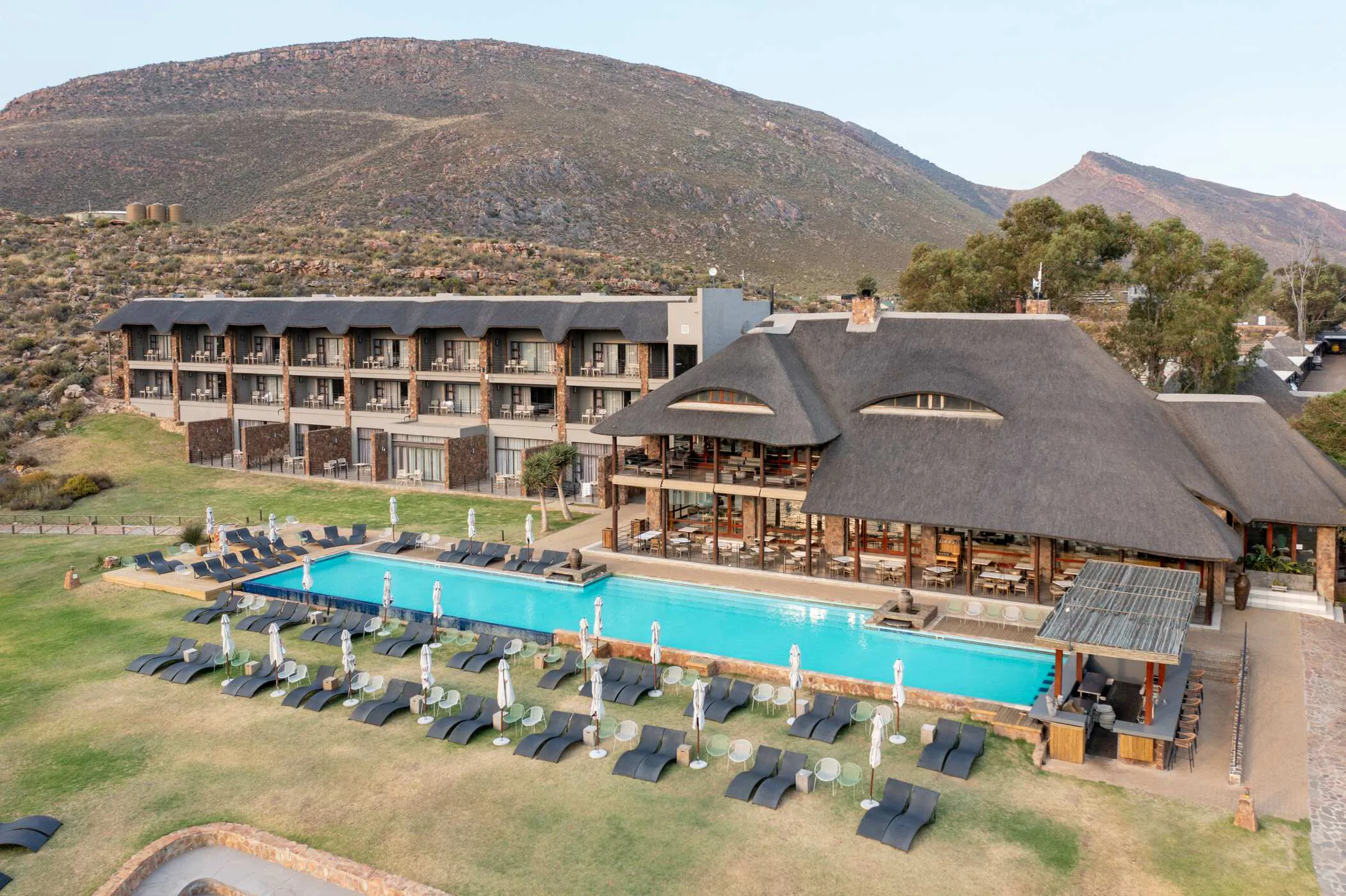 Aerial view of the Aquila lodge, pool and Karoo mountains