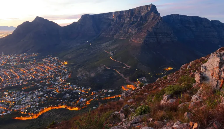 Table Mountain above the lights of Cape Town at dusk