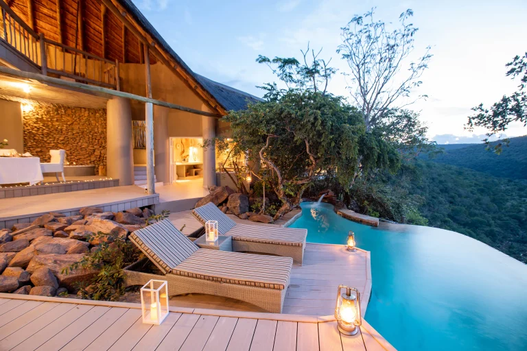 Suite deck and plunge pool on the cliff edge at dusk at Clifftop