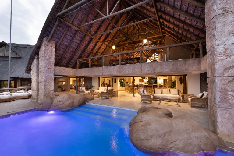 Pool and thatched lounge at Kingfisher Villa