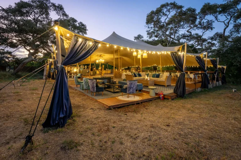Lounge tent lit at dusk