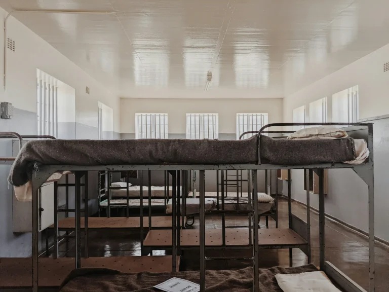 Bunk beds in a former prison dormitory