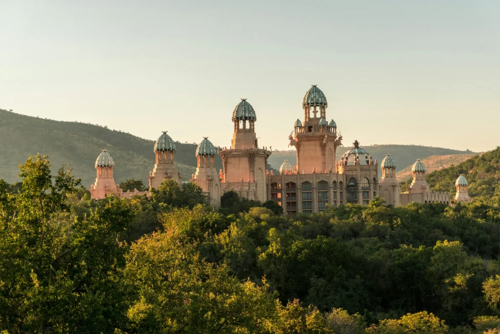 The Palace of the Lost City at Sun City rising above the bush at sunset