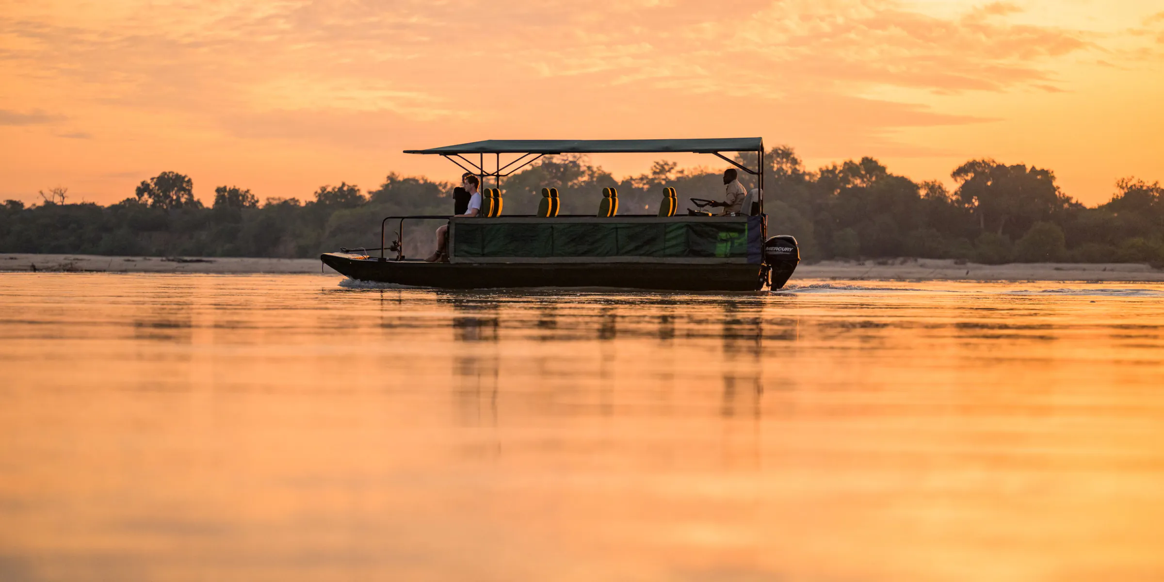 Boat safari on the Rufiji River at sunset in Nyerere National Park