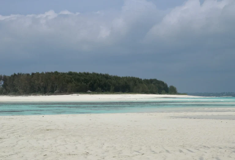 Wide white beach at low tide on Zanzibar